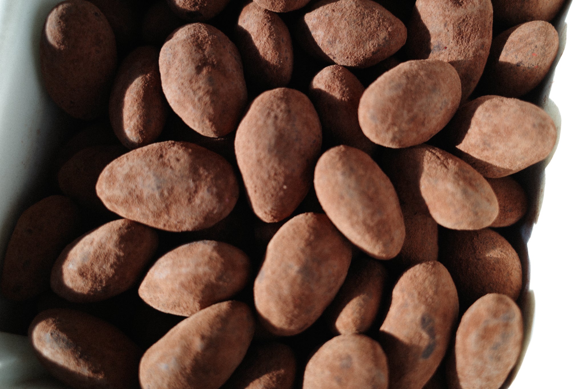 CHOCOLATE COVERED ALMONDS WITH PINK PEPPERCORN